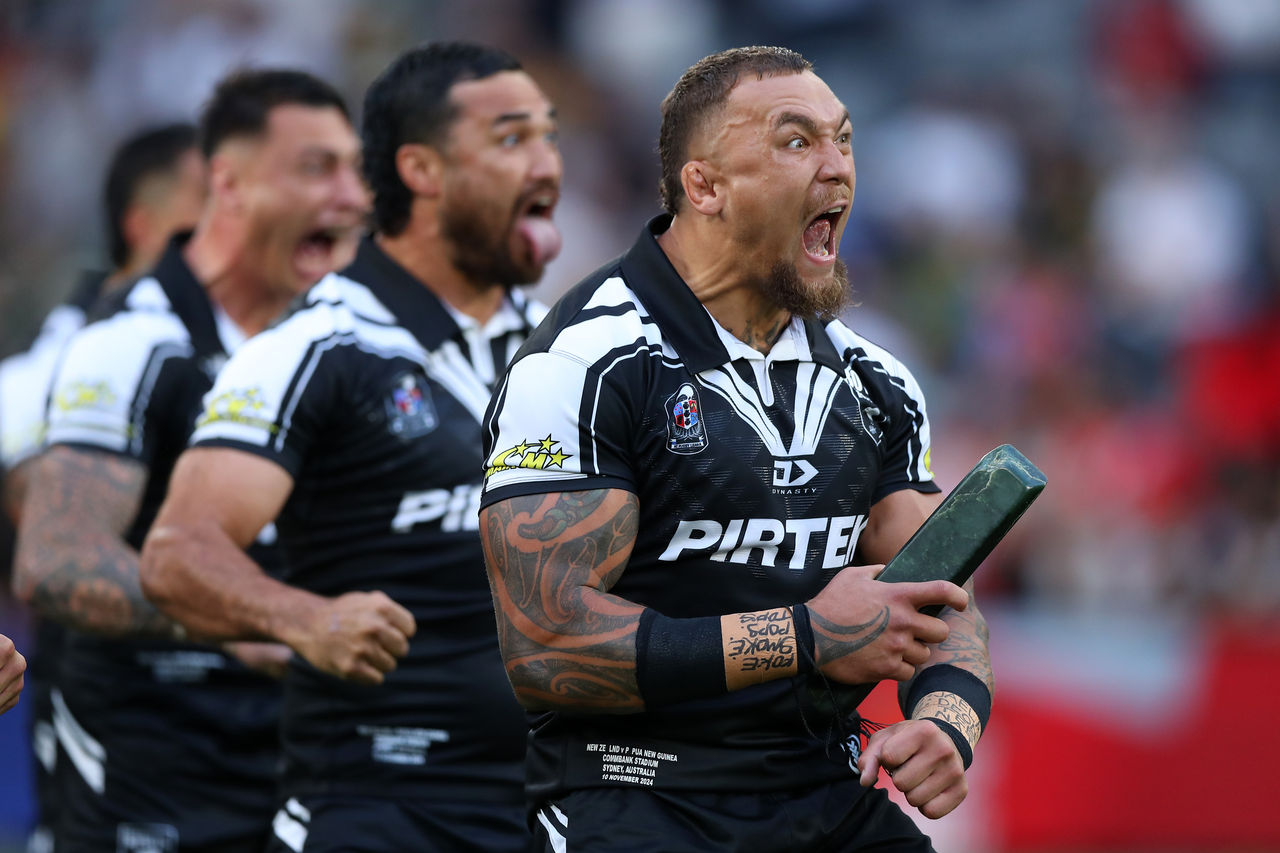 New Zealand player James Fisher-Harris on the ground with their team