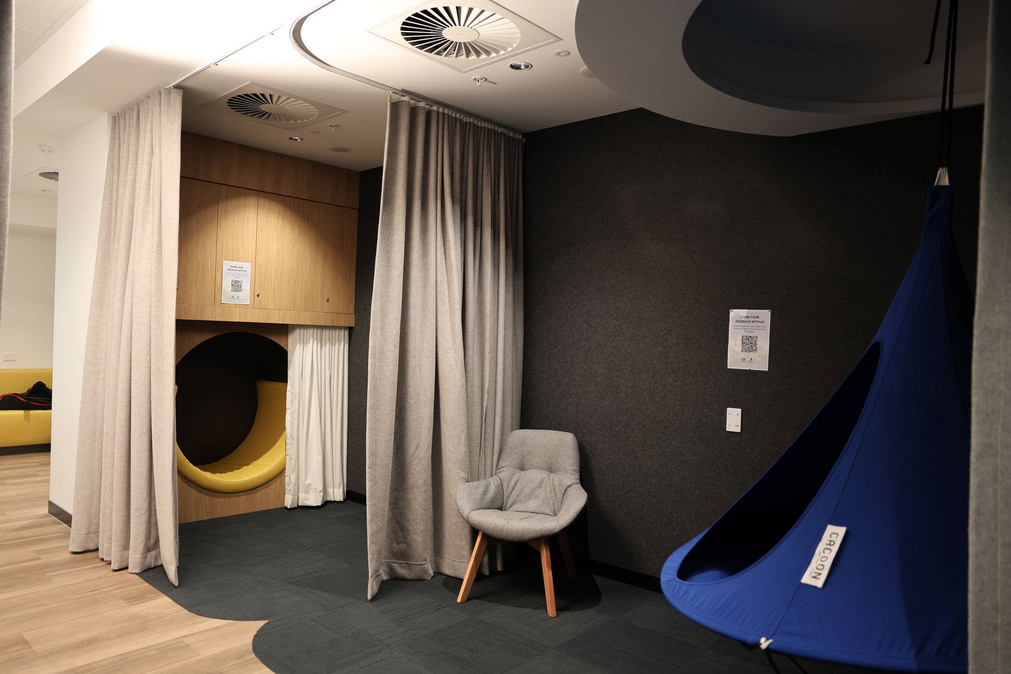 The interior of a quiet room with soft seating and low lights