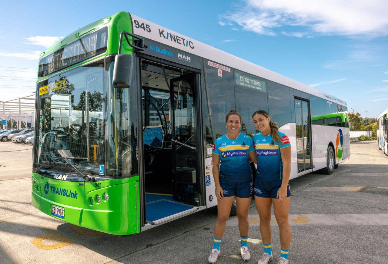 Resized - Titans NRLW players next to bus