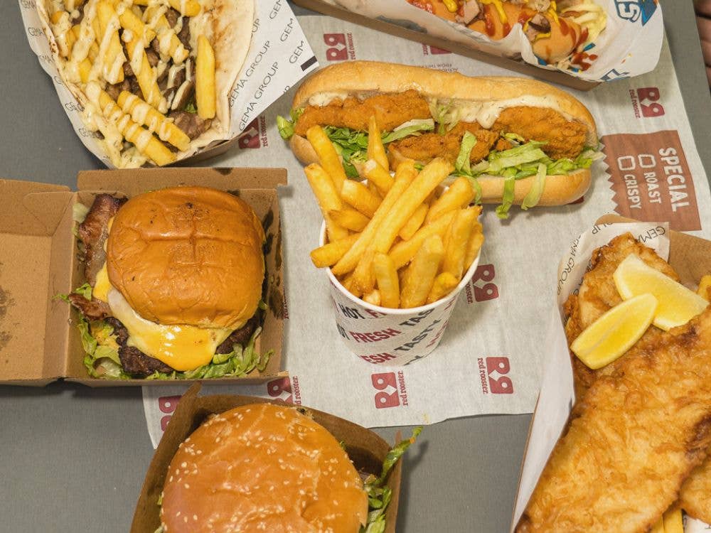A range of food options that include burgers, chips, rolls and fish