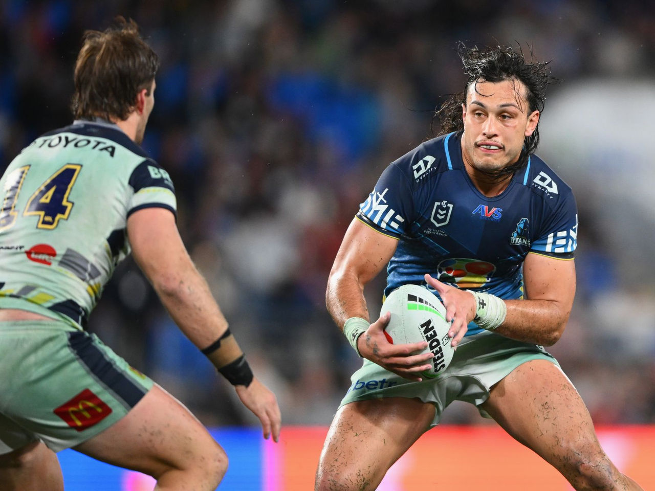 NRL Gold Coast Titans Tino holding the NRL ball