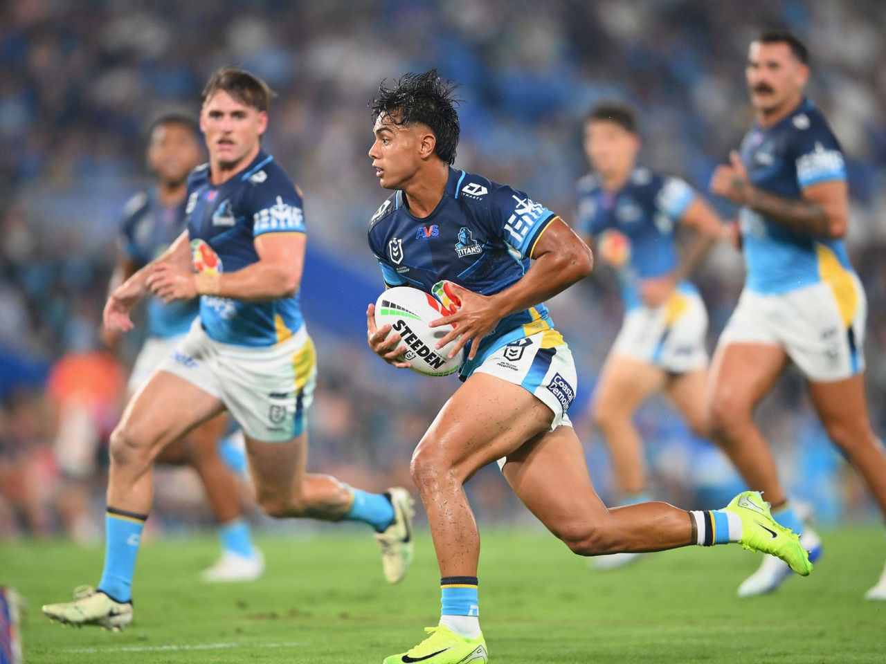 NRL Gold Coast Titans players running on the field